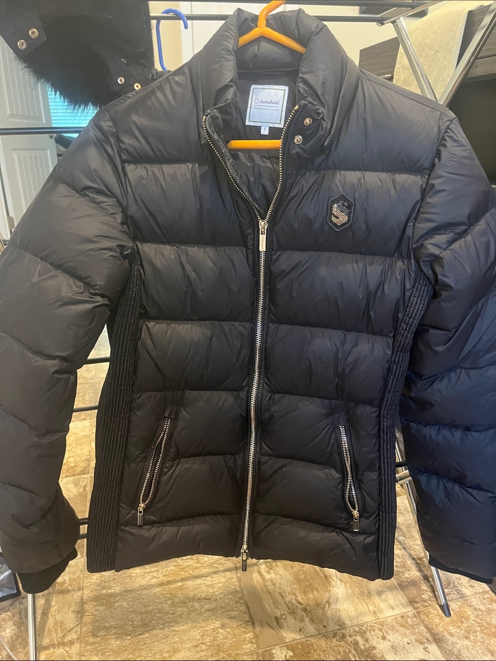Samshield down jacket with rose gold accents